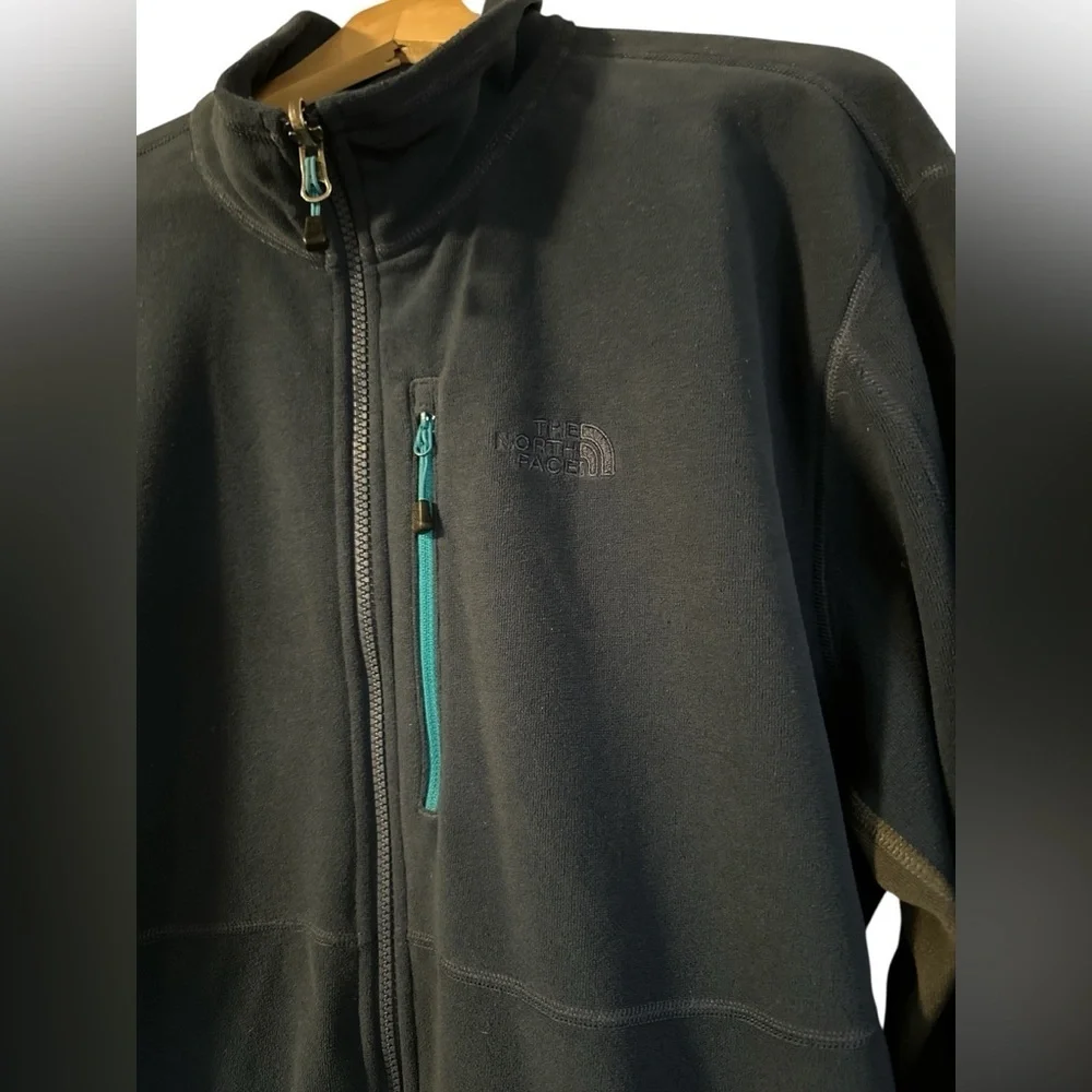 The North Face Navy Blue Fleece with Teal Accent Pocket and Dark Gray Side Panel